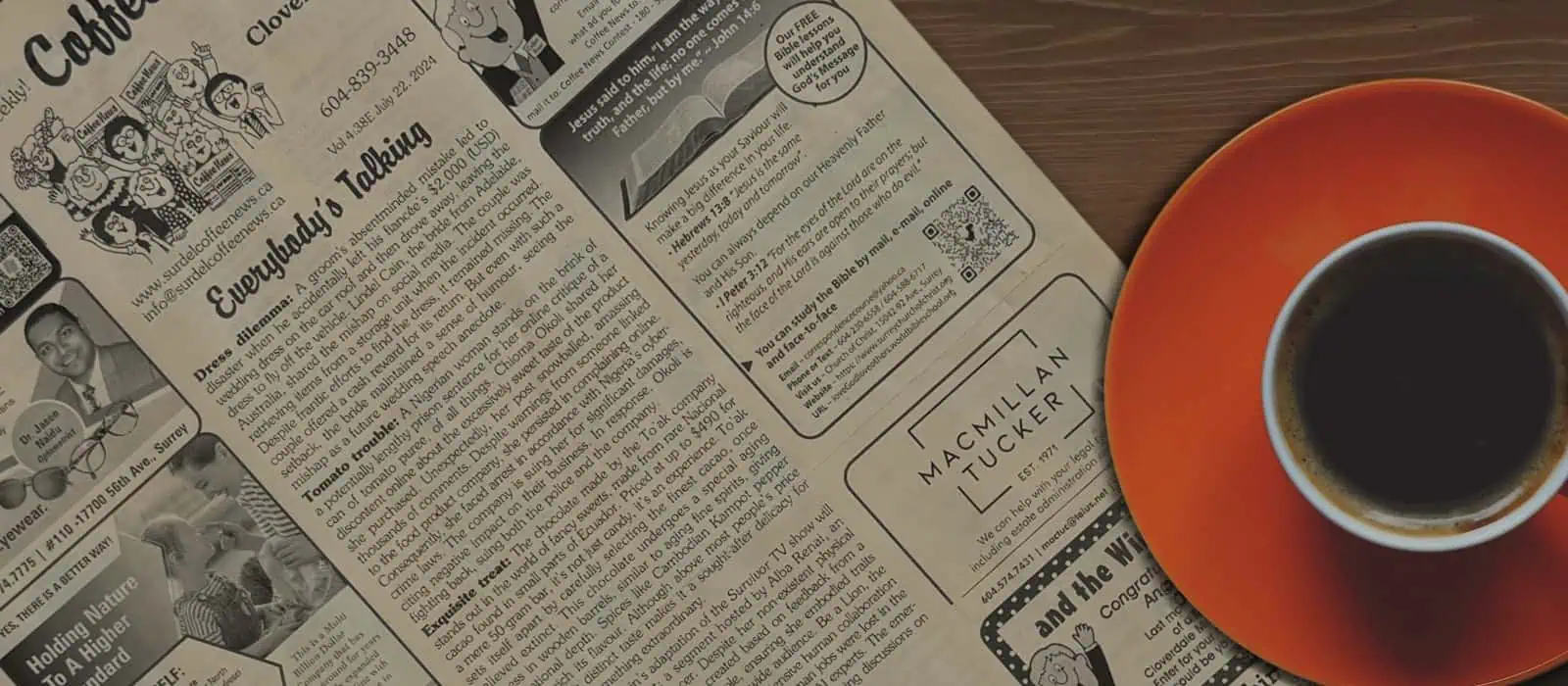 Coffee News on a desk with a cup of coffee